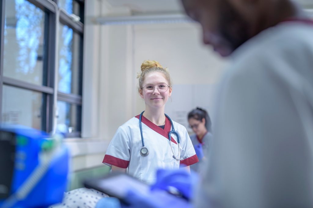 Portrait of smiling nurse on hospital ward
